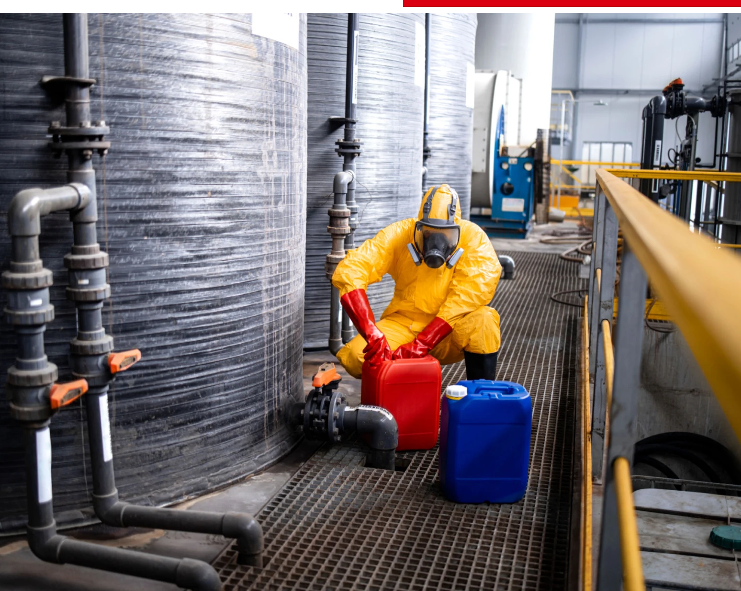 Safety gear worn by worker near tanks