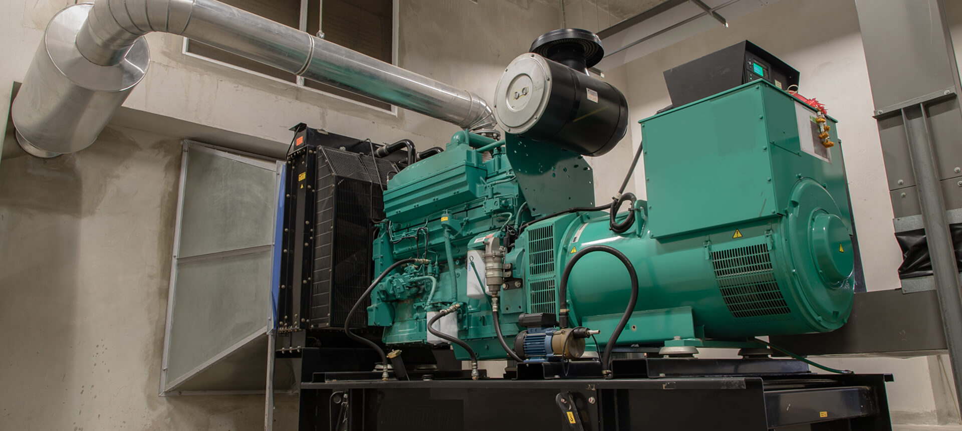 Industrial generator in a mechanical room.